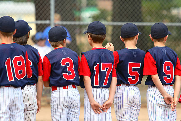 Little League players standing in line before a game.